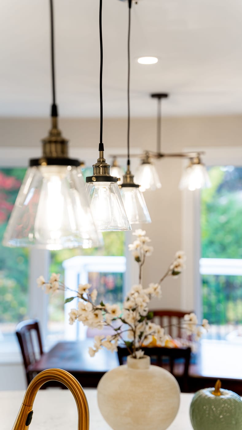Dining area with designer glass pendant lighting