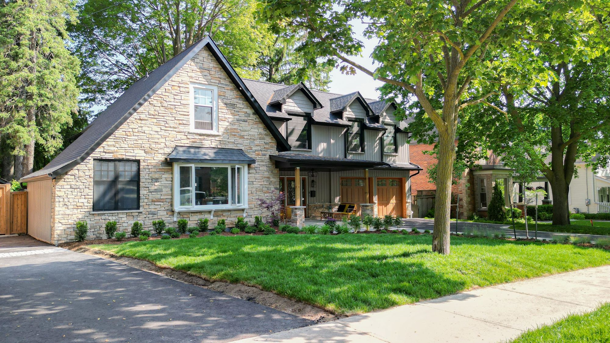 Finished stone and board-and-batten home by AC Custom Reno